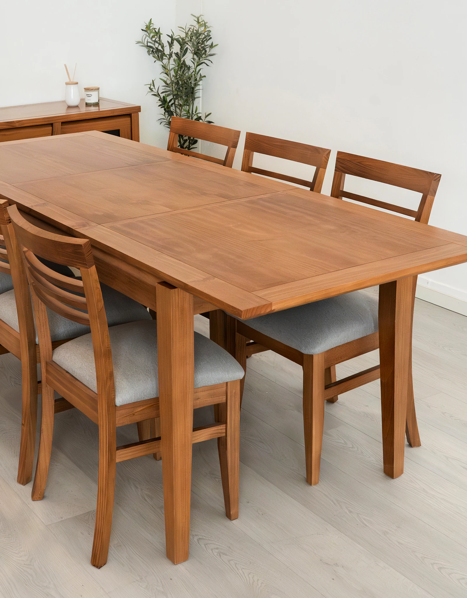 Wooden dining table with six wooden chairs