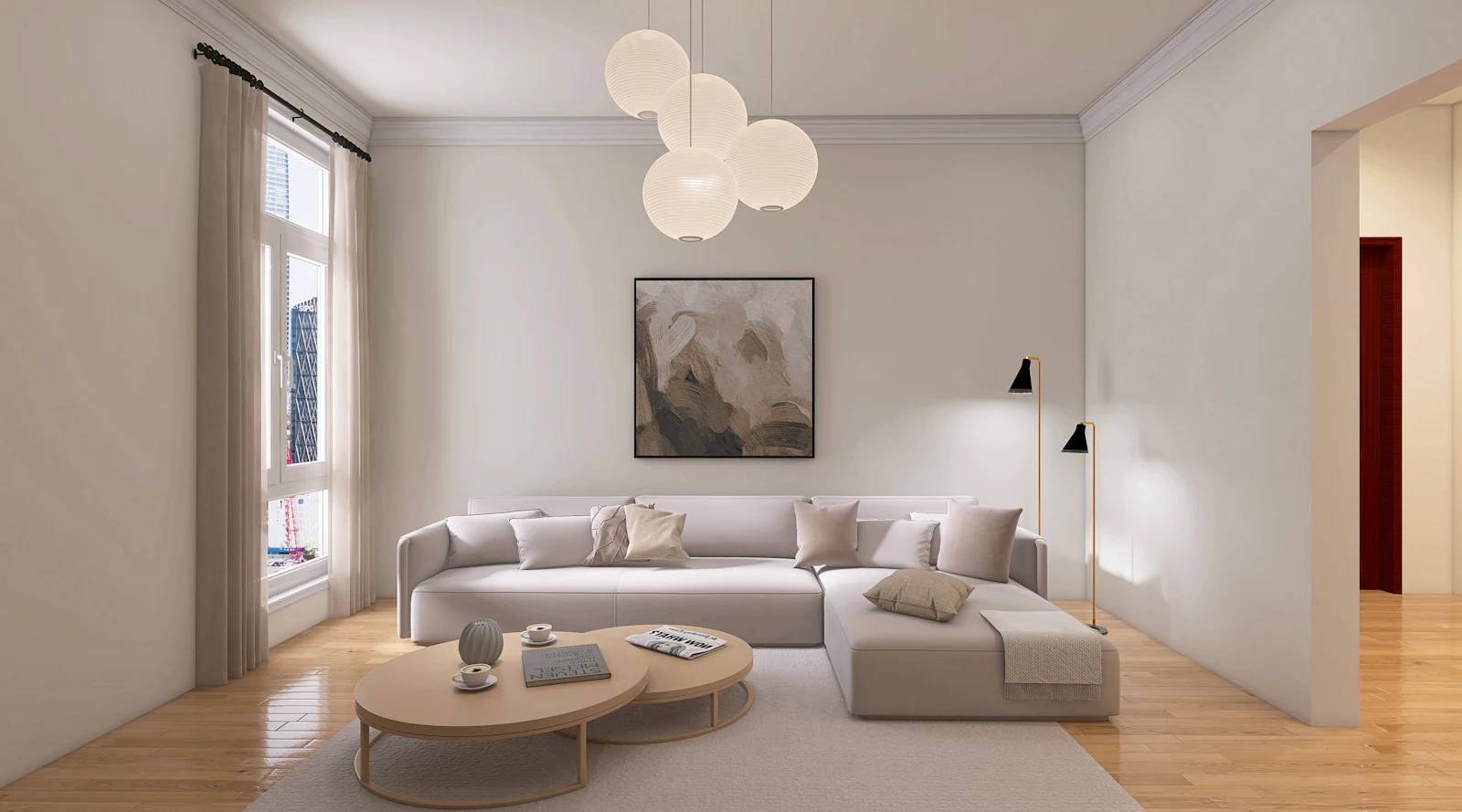 White sectional sofa with a globe pendant and an oval coffee table