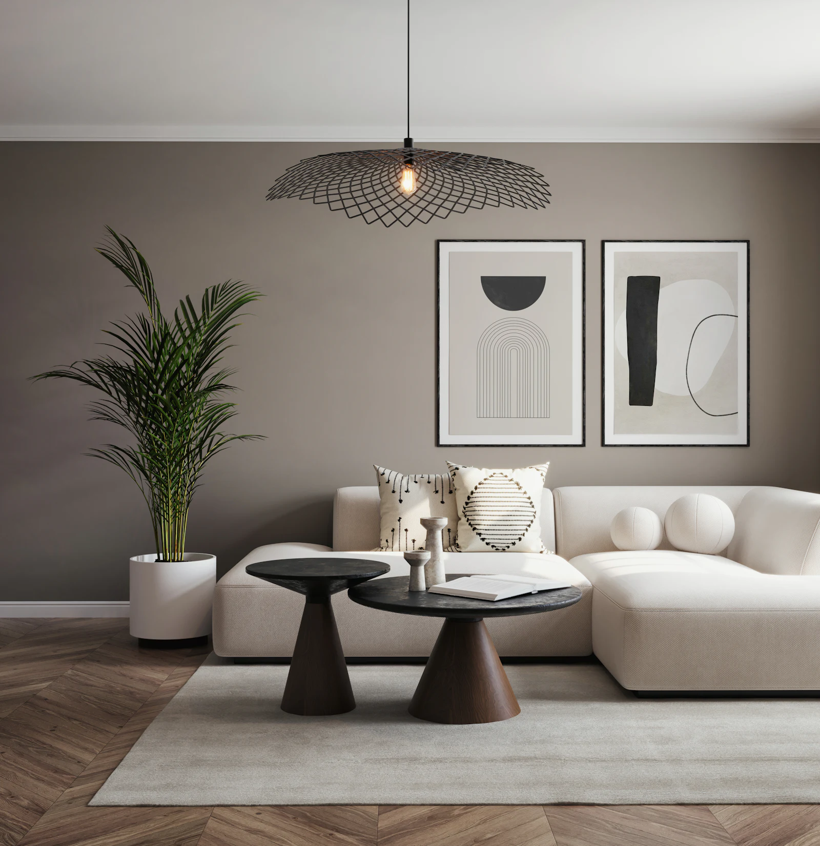 Cream sofa against a taupe wall with abstract framed prints
